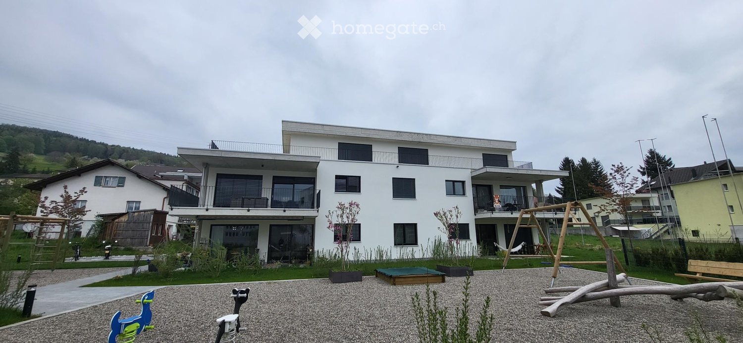 2 story house, white exterior, multiple balconies, modern design, surrounded by greenery