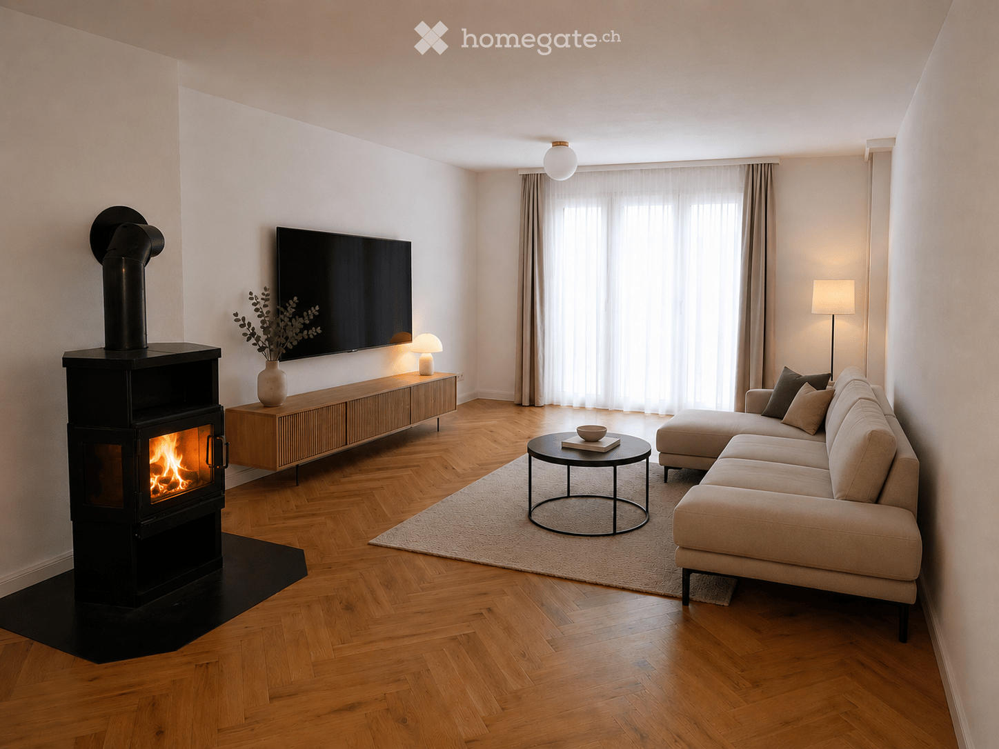 Modern living room with a sectional sofa, coffee table, fireplace, TV, side table with vase, and floor lamp.