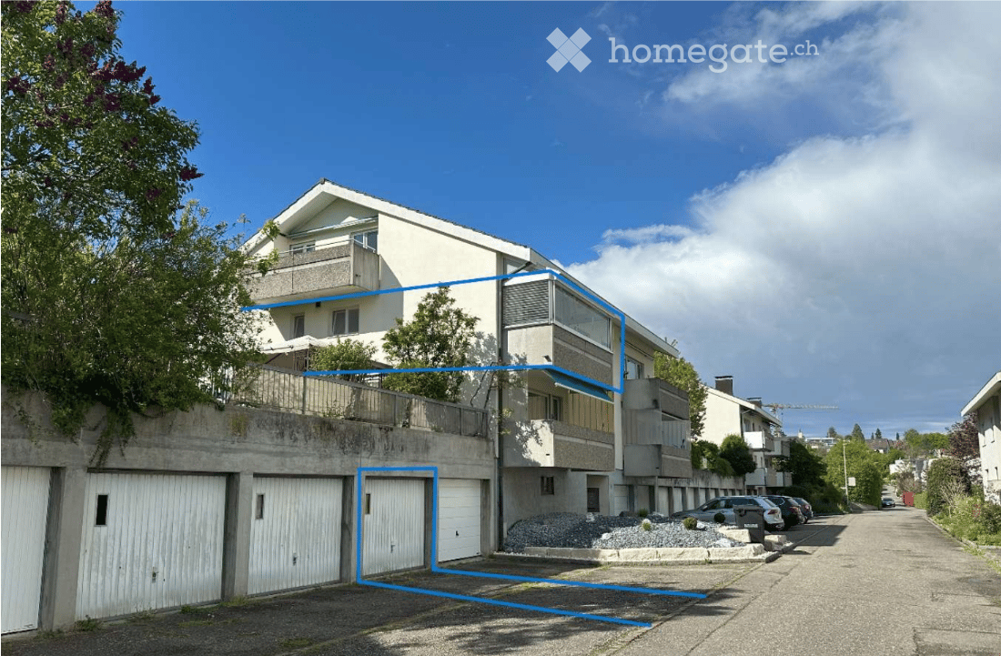 3-story apartment building, white exterior, multiple garages, balcony, trees, street