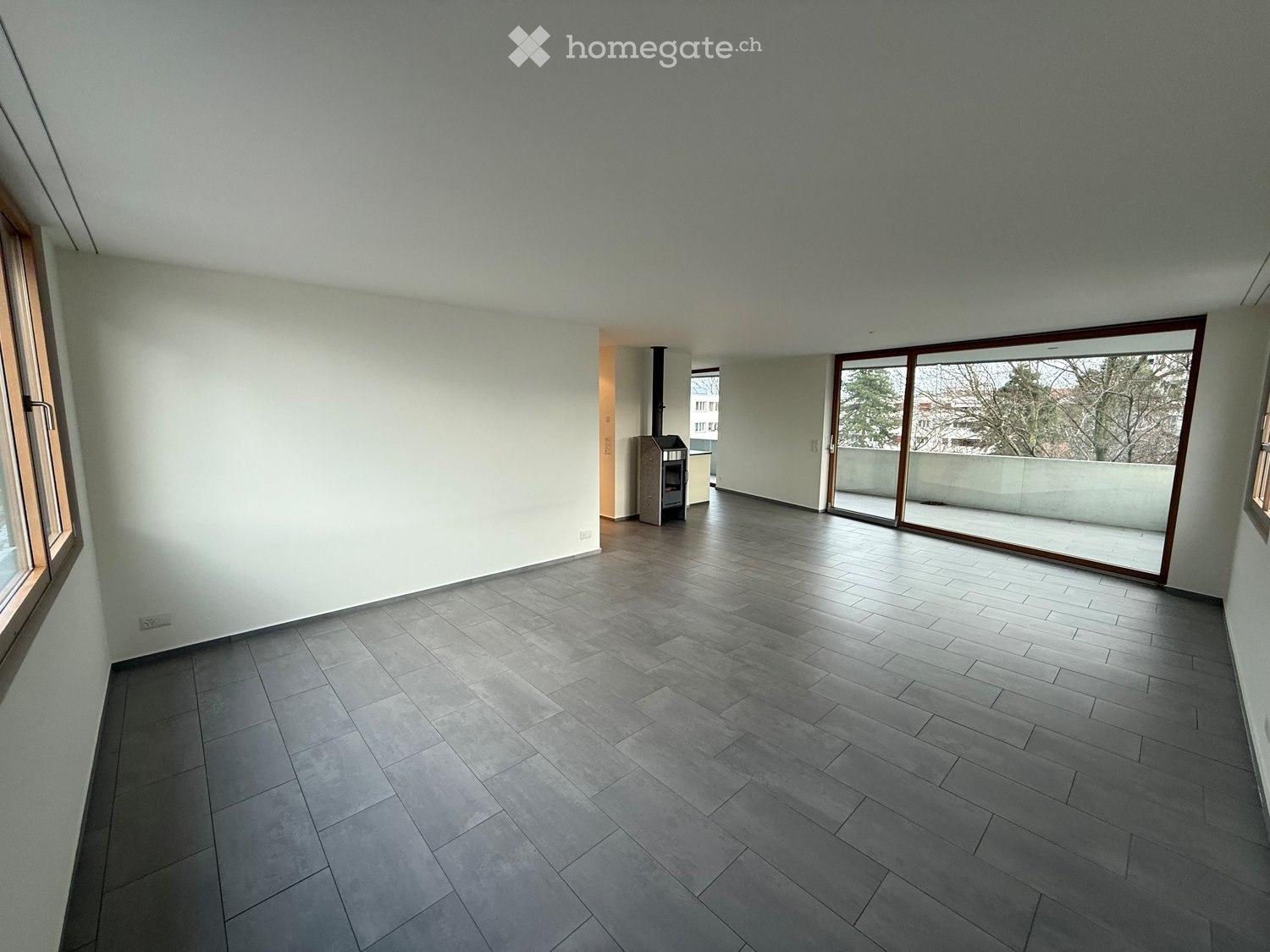 empty room, white walls, wooden floor, sliding glass doors, balcony