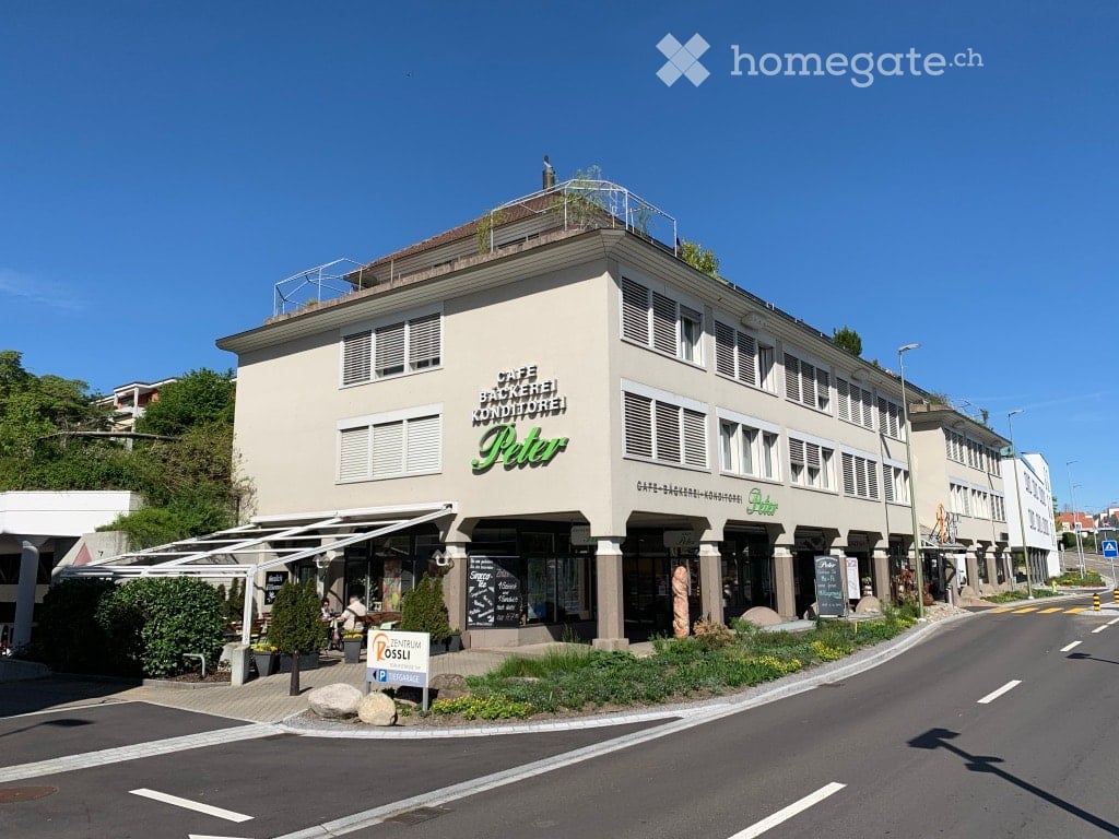Three story building, cafe and bakery shop, exterior awning, garden, street sign