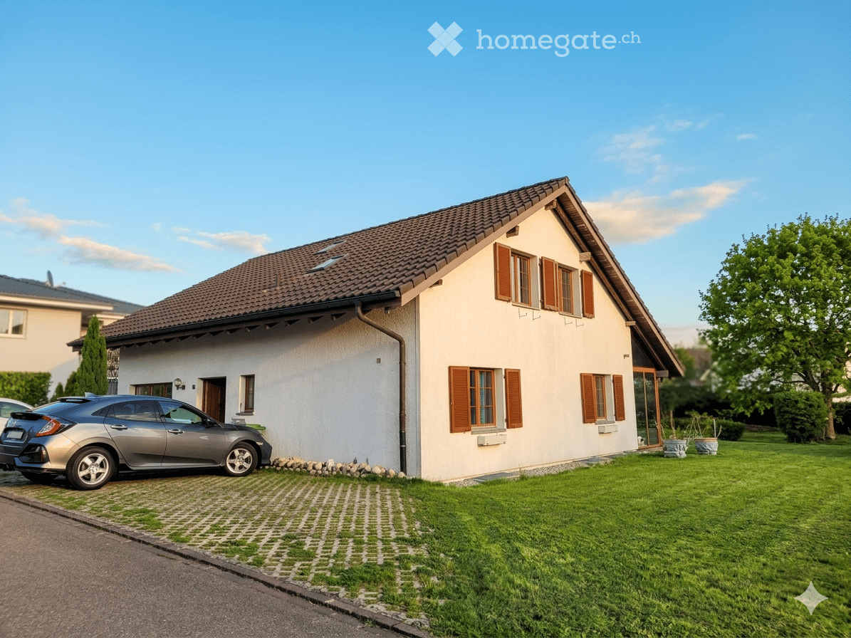 House. Single-family house with a tiled roof, light-colored exterior, multiple windows with shutters, and a driveway with a parked car.