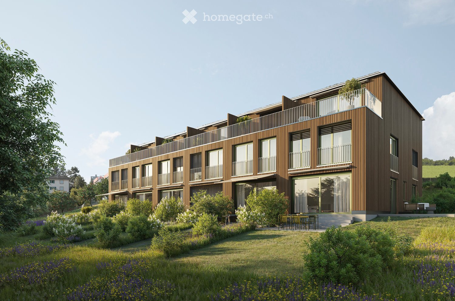 Building. Modern multi-story building with wooden facade, large windows, balconies, and surrounding garden area with greenery and outdoor seating.