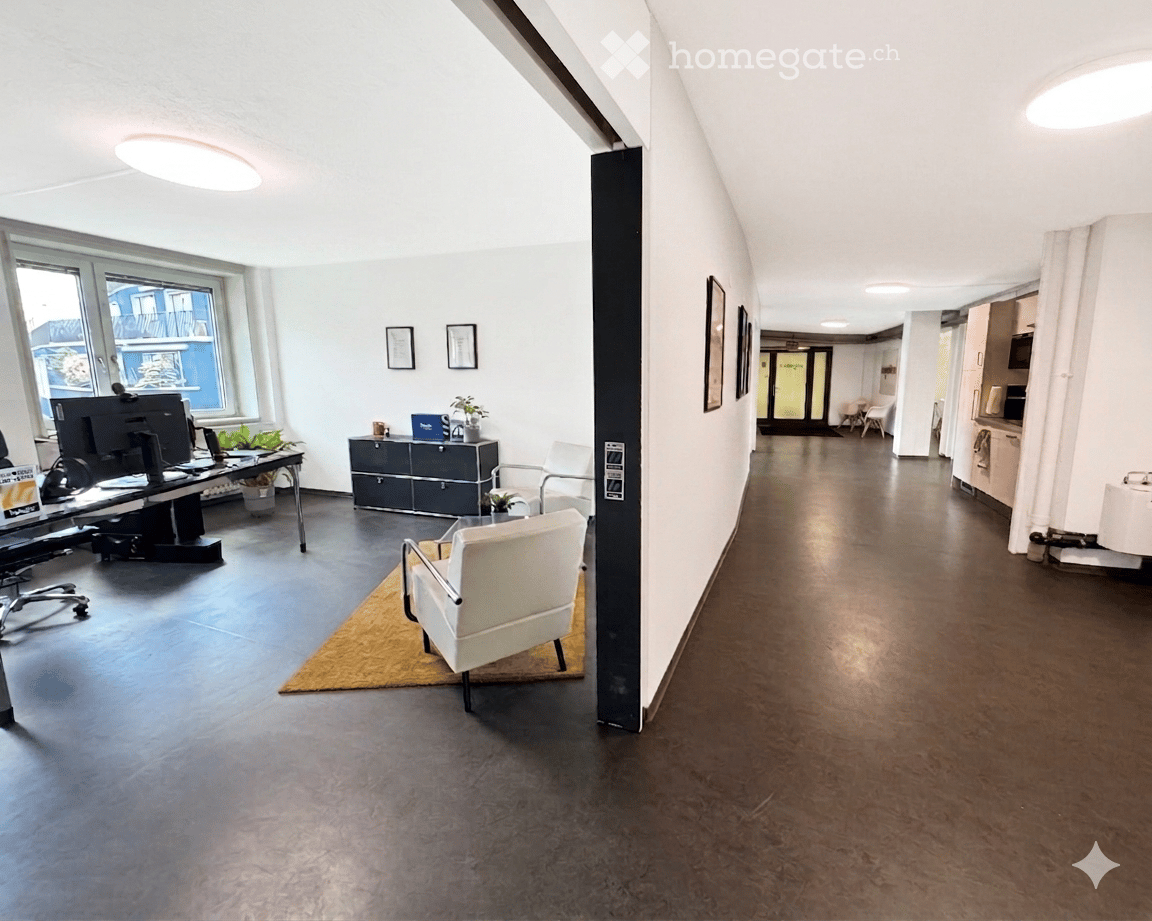 Furnished Room. Modern office space with a reception area, featuring a white chair, a small table, a screen, a grey cabinet, and a potted plant.