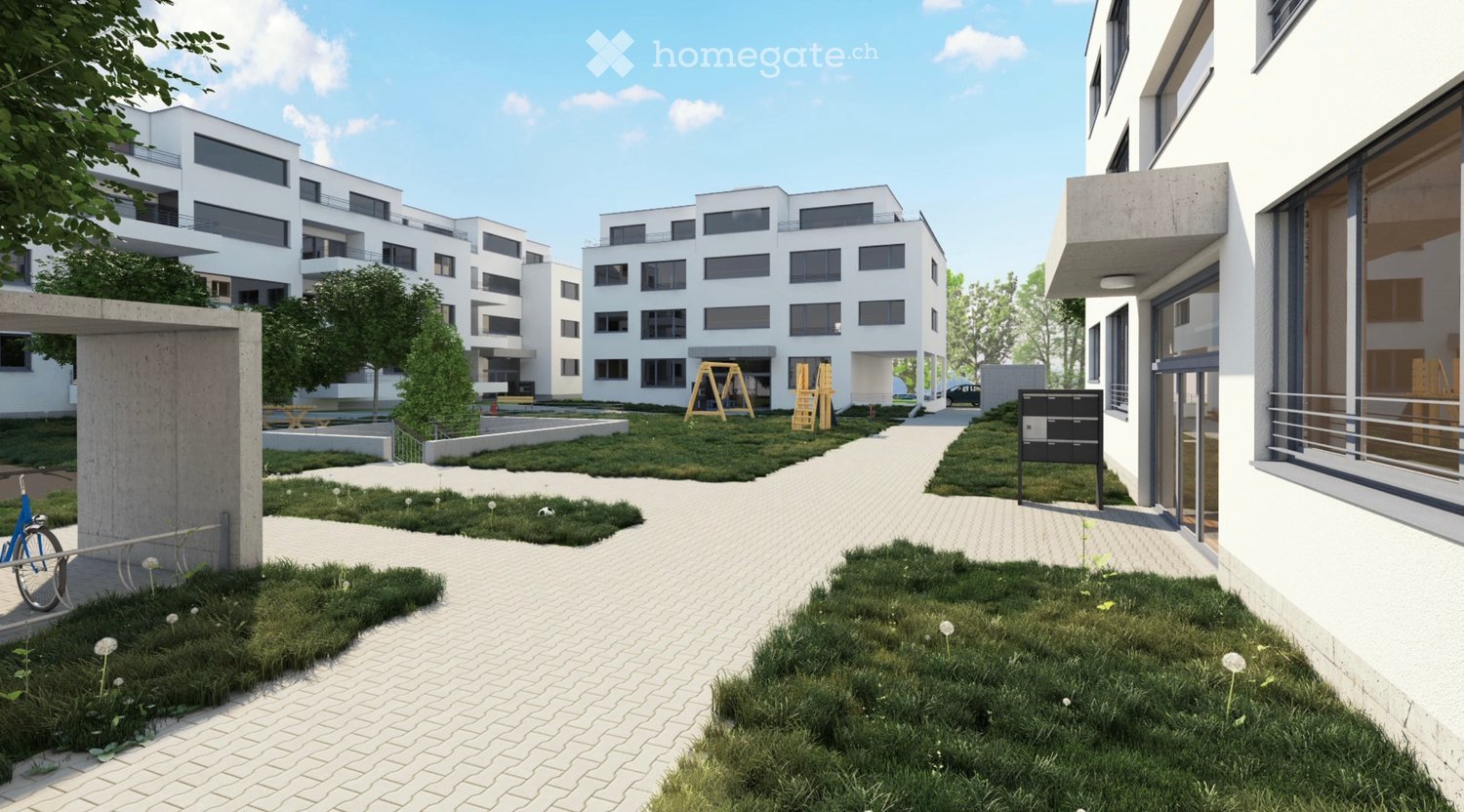 paved walking path, grassy area, modern white buildings, playground equipment