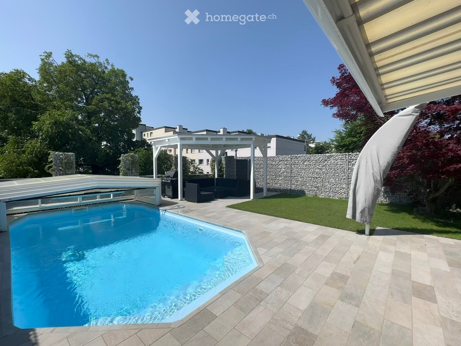 Outdoor area with swimming pool, pergola, barbecue, outdoor seating, green grass, patio tiles