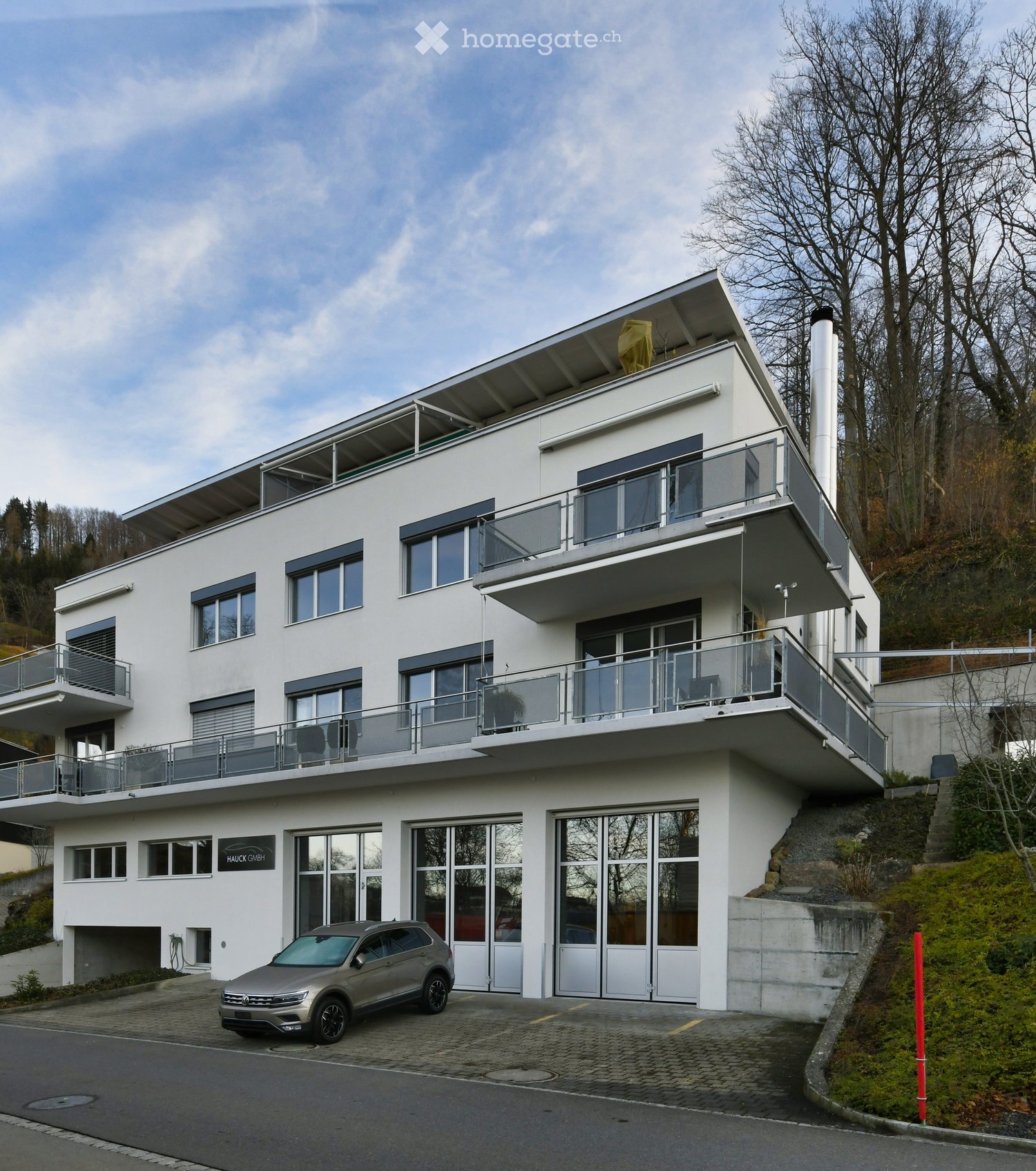 modern white house, 3 floors, large windows, balconies, car parked in front
