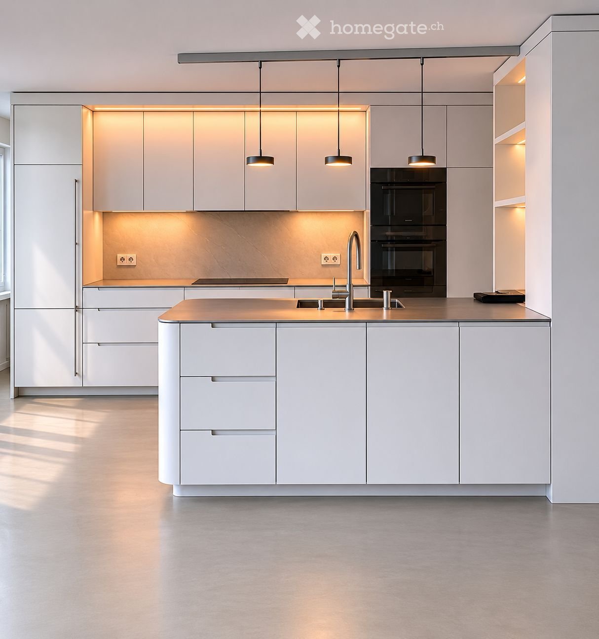 Modern kitchen with white cabinets, a central island, built-in oven, and pendant lighting.