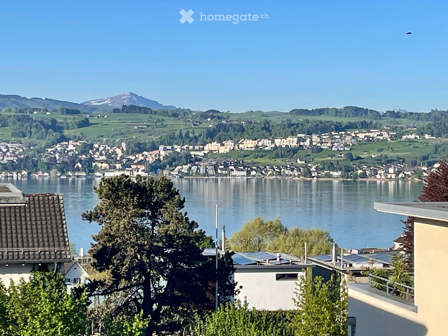 House with a view of a lake and mountains
