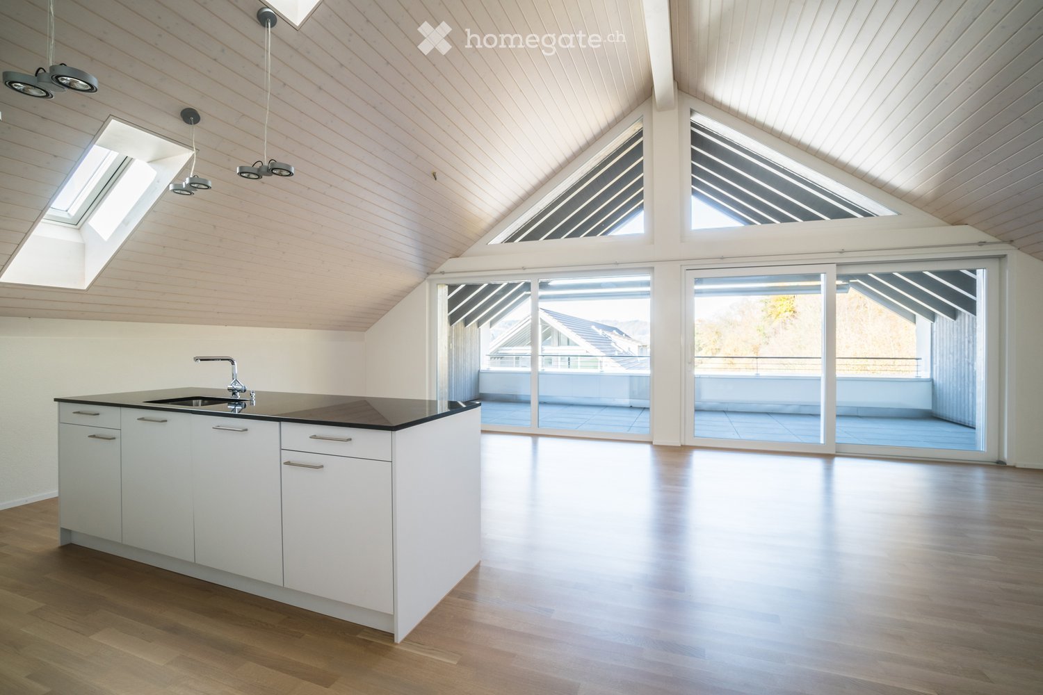 modern kitchen with white cabinets, black countertop, sink, faucet, wooden floor, large windows, balcony