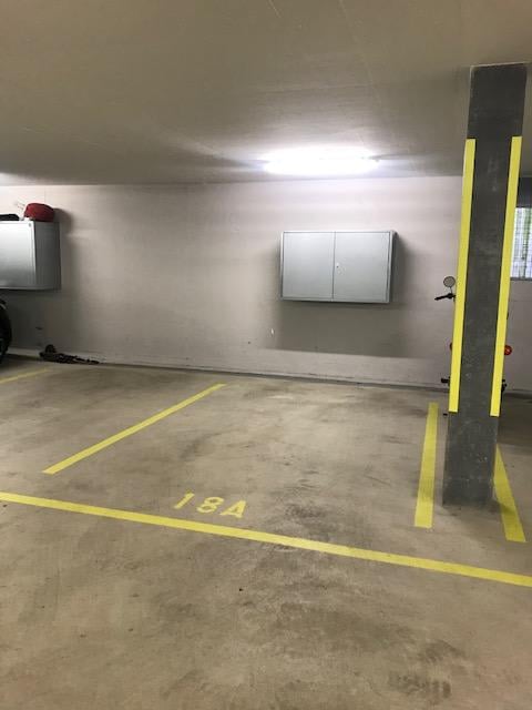 {"type": "Garage", "objects": [], "description": "Empty underground parking space with marked parking spots, concrete floor, and metal storage cabinets on the walls.", "visible_features": ["Garage"], "localized_descriptions": {"EN": "Empty underground par