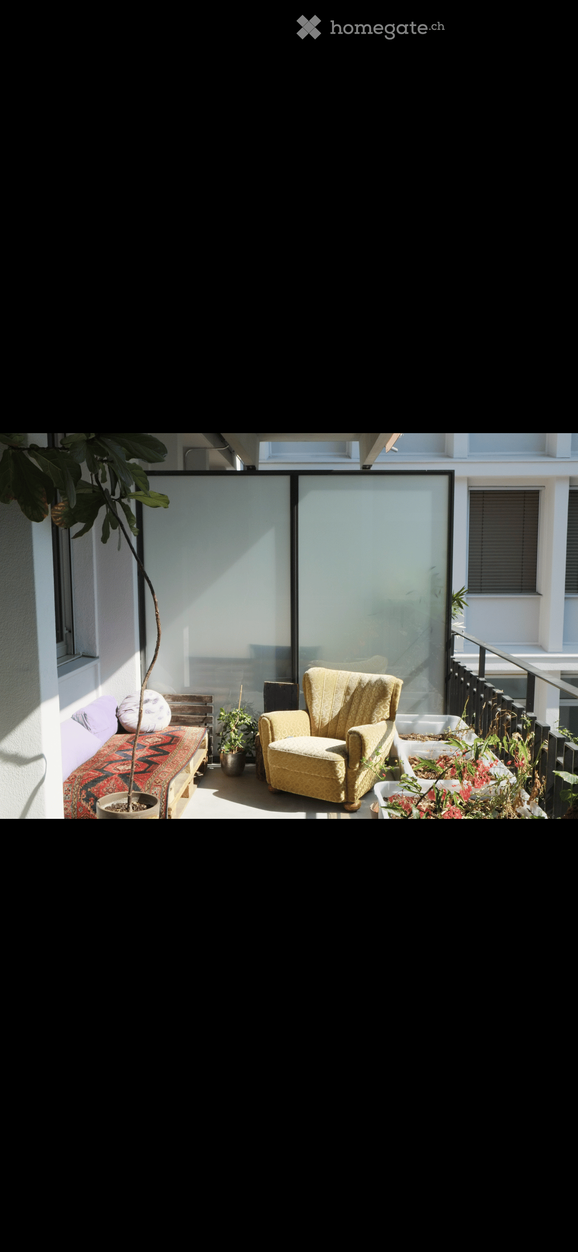 Balcony with a yellow armchair, a wooden bench with cushions, and several potted plants, including a tall tree in a pot.