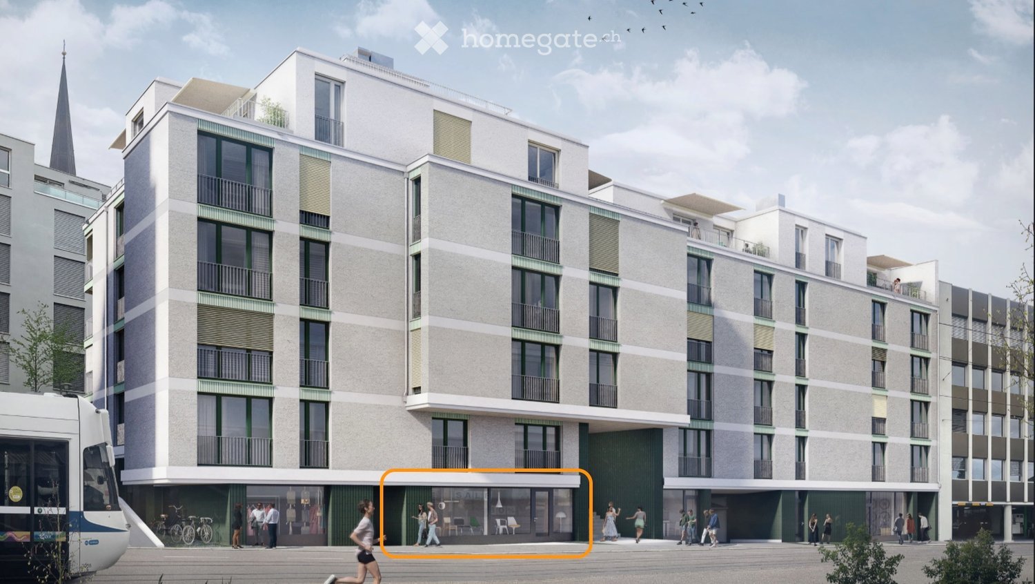 Modern multi-story residential building with balconies, large windows, and a contemporary design. The ground floor features a commercial area with seating and a tram passing by.