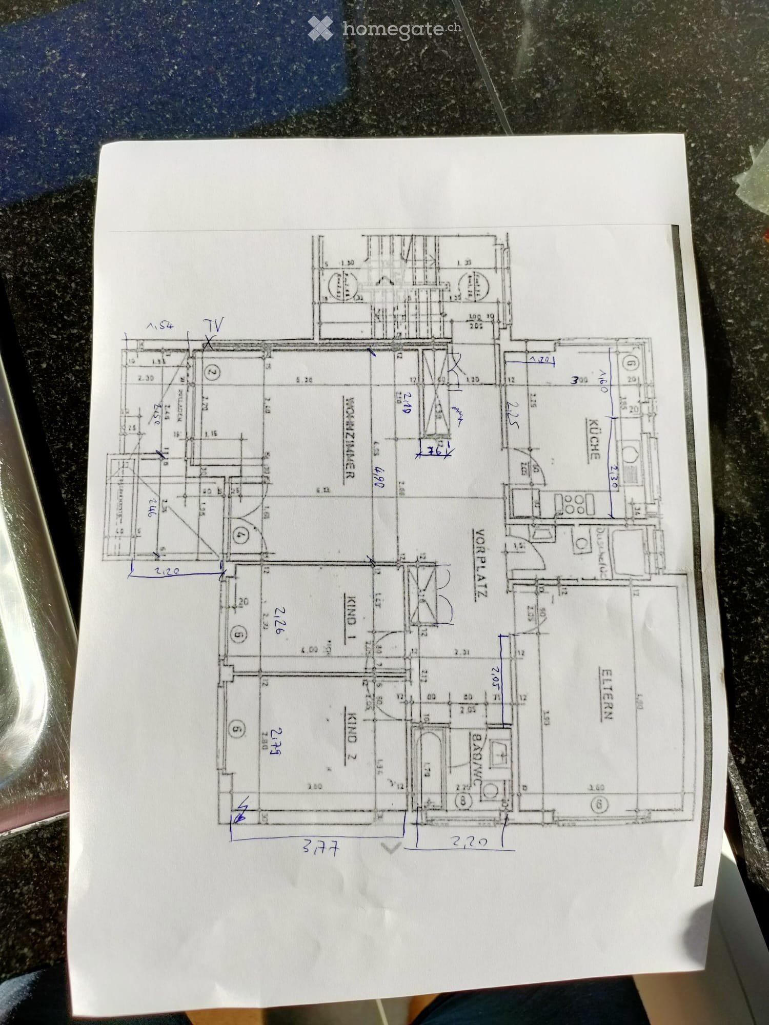 Floor plan of a residential space showing multiple rooms including a living room, kitchen, bedrooms, and bathrooms. Dimensions and room labels are visible.