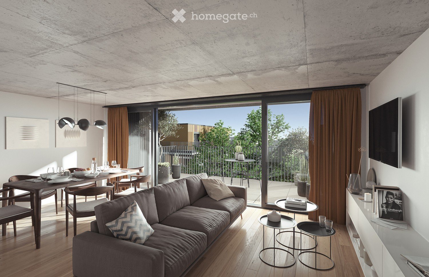 Modern living and dining area with a grey sectional sofa, wooden dining table, pendant lights, and large windows leading to a balcony.