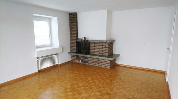 Grosszügige 5.5-Zimmer-Maisonettewohnung mit Gartenanteil und Cheminée in einem Zweifamilienhaus 5