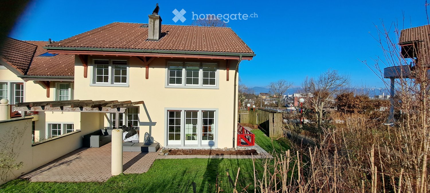 2 story house, brown roof, large windows, wooden pergola, garden, patio, lawn