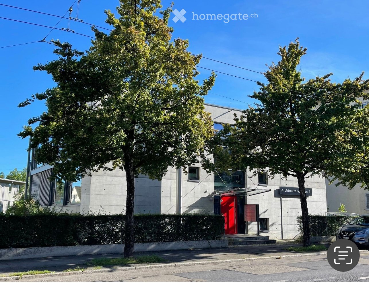 modern building, concrete wall, glass windows, red door, tree-lined street