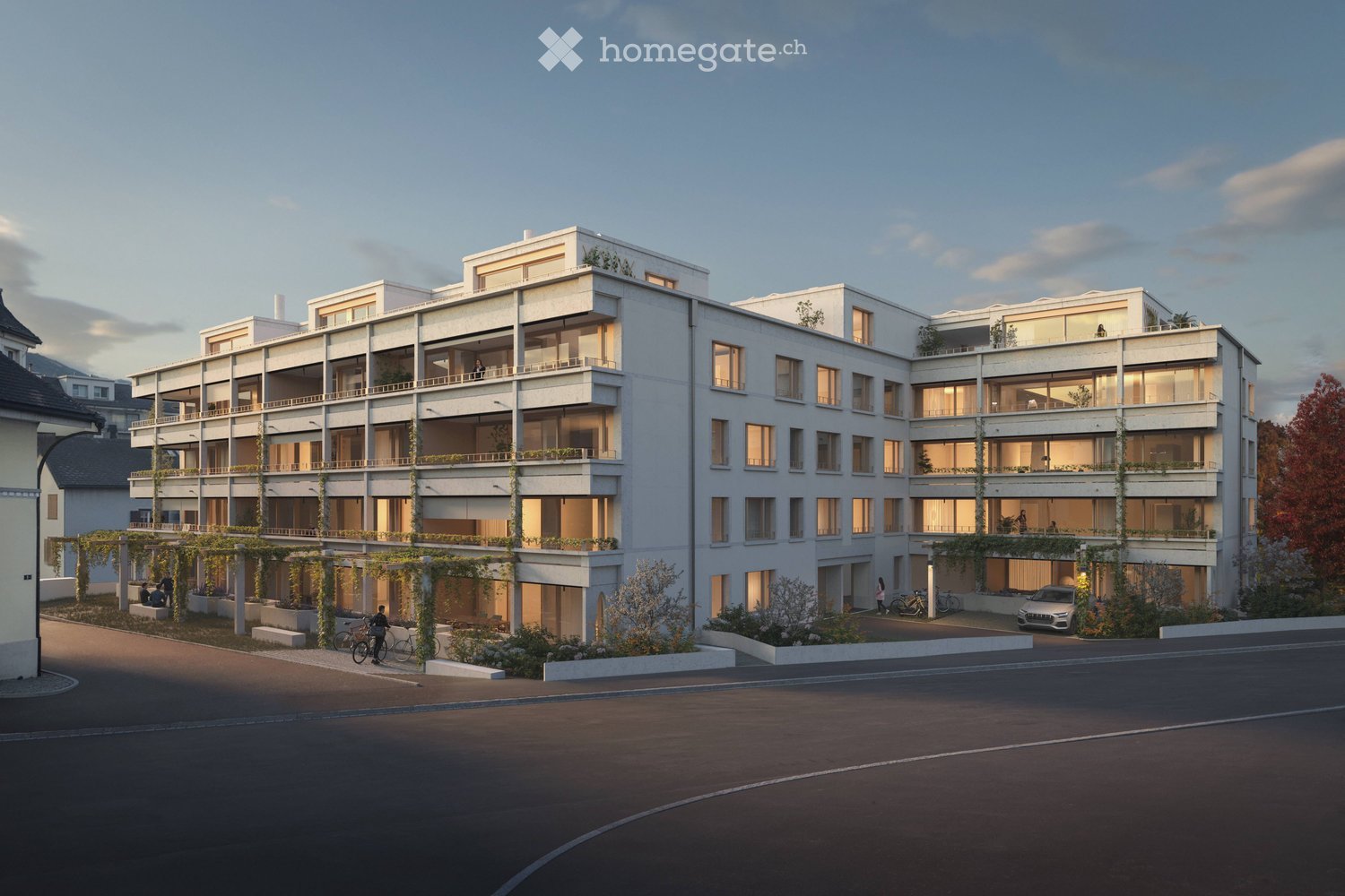 Apartment building, white, several balconies, underground garage, parking space, bicycles