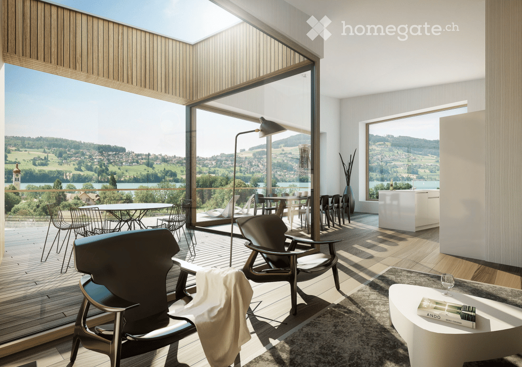 Modern living room with large windows offering scenic views, featuring a sofa, coffee table, chairs, and a dining area with a table and chairs.