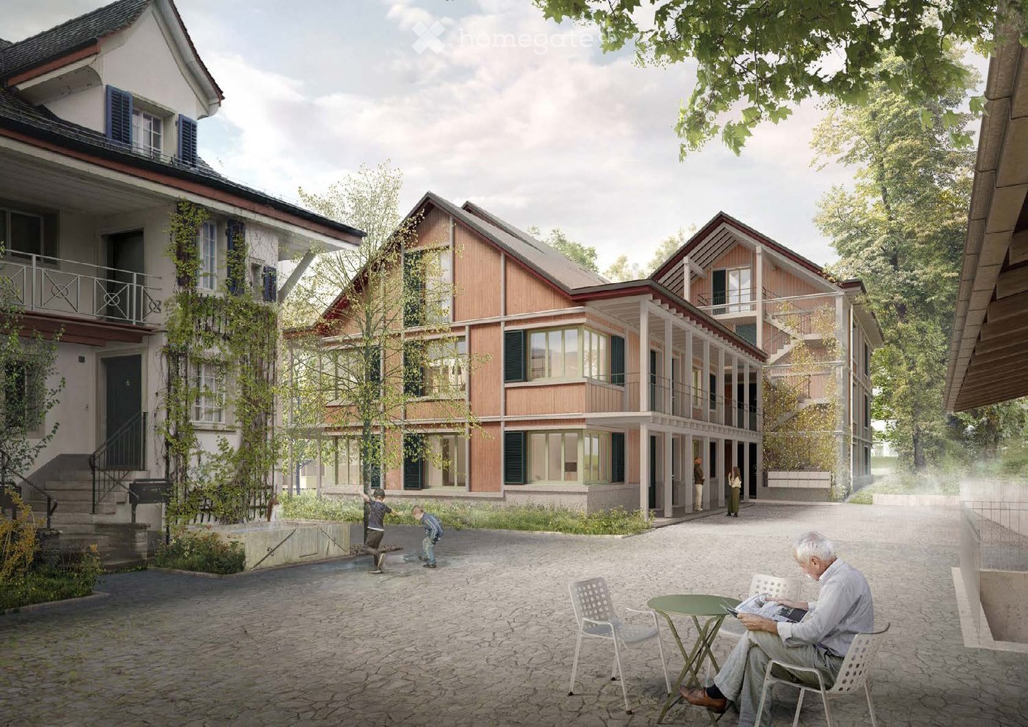A modern residential complex with a mix of traditional and contemporary architecture, featuring multiple buildings with balconies, large windows, and a central courtyard with seating areas.
