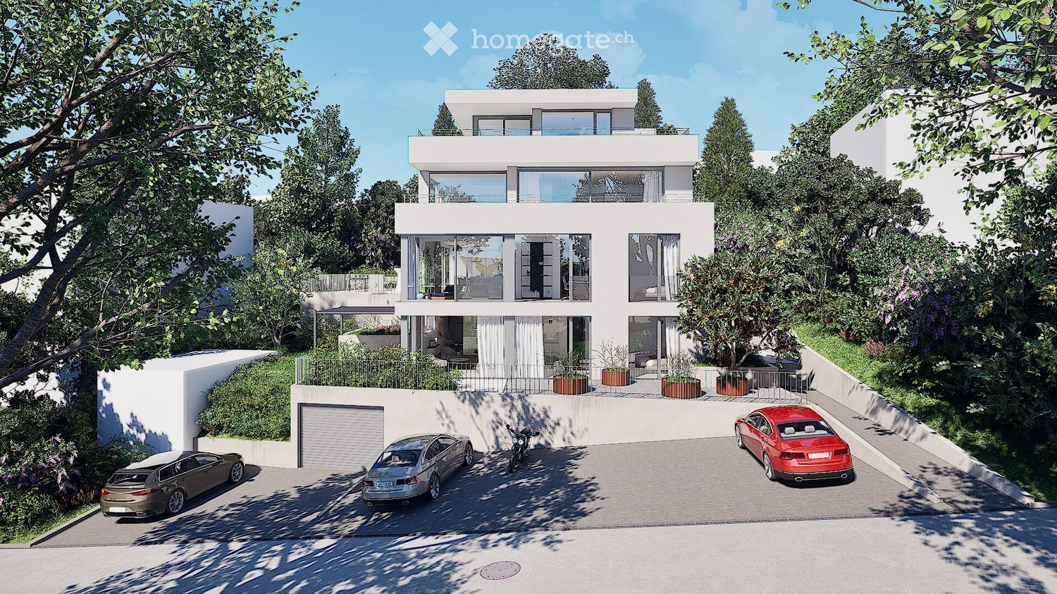 Modern two-story house with white exterior, large windows, and a balcony on the upper level. The house is surrounded by greenery and features a driveway with three parked cars and a garage.