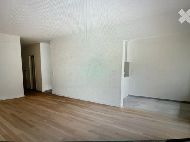 Completely empty room with bare walls and wooden floor. No furniture or equipment.