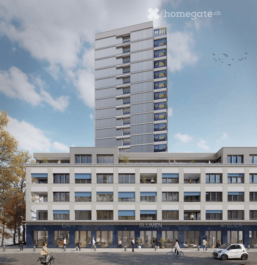 Modern multi-story building with contemporary design, featuring large windows, balconies, and commercial storefronts labeled "CAFE," "BLUMEN," and "ATELIER." The ground floor includes seating areas and bicycles.