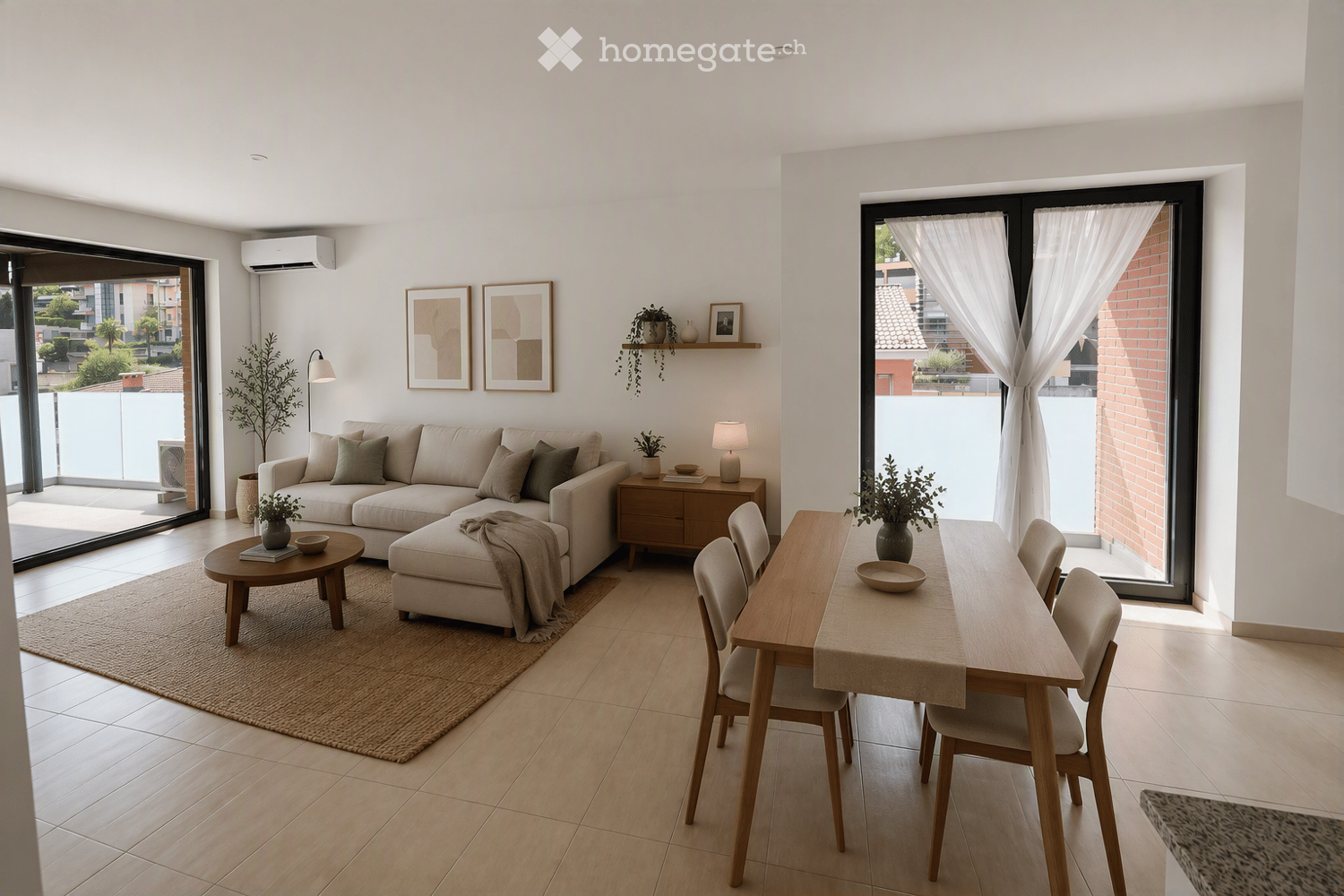 Modern living and dining area with light-colored furniture, including a sectional sofa, coffee table, ottoman, dining table with chairs, side table with lamp, and decorative items on shelves.