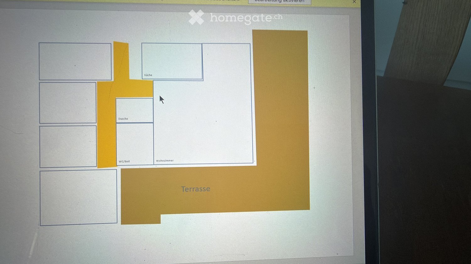 Floor plan showing a kitchen, bathroom, living room, and a large terrace.
