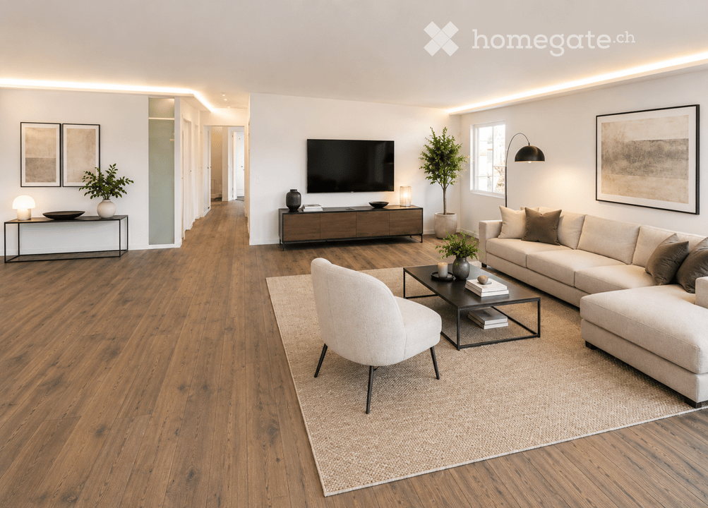 Modern living room with hardwood flooring, large sectional sofa, coffee table, armchair, TV, side tables, lamps, and decorative plants.