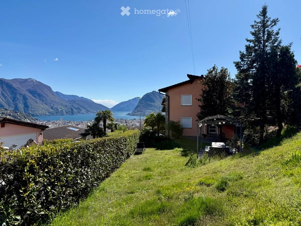 Ampio appartamento di 5 locali con una splendida vista a Porza 1