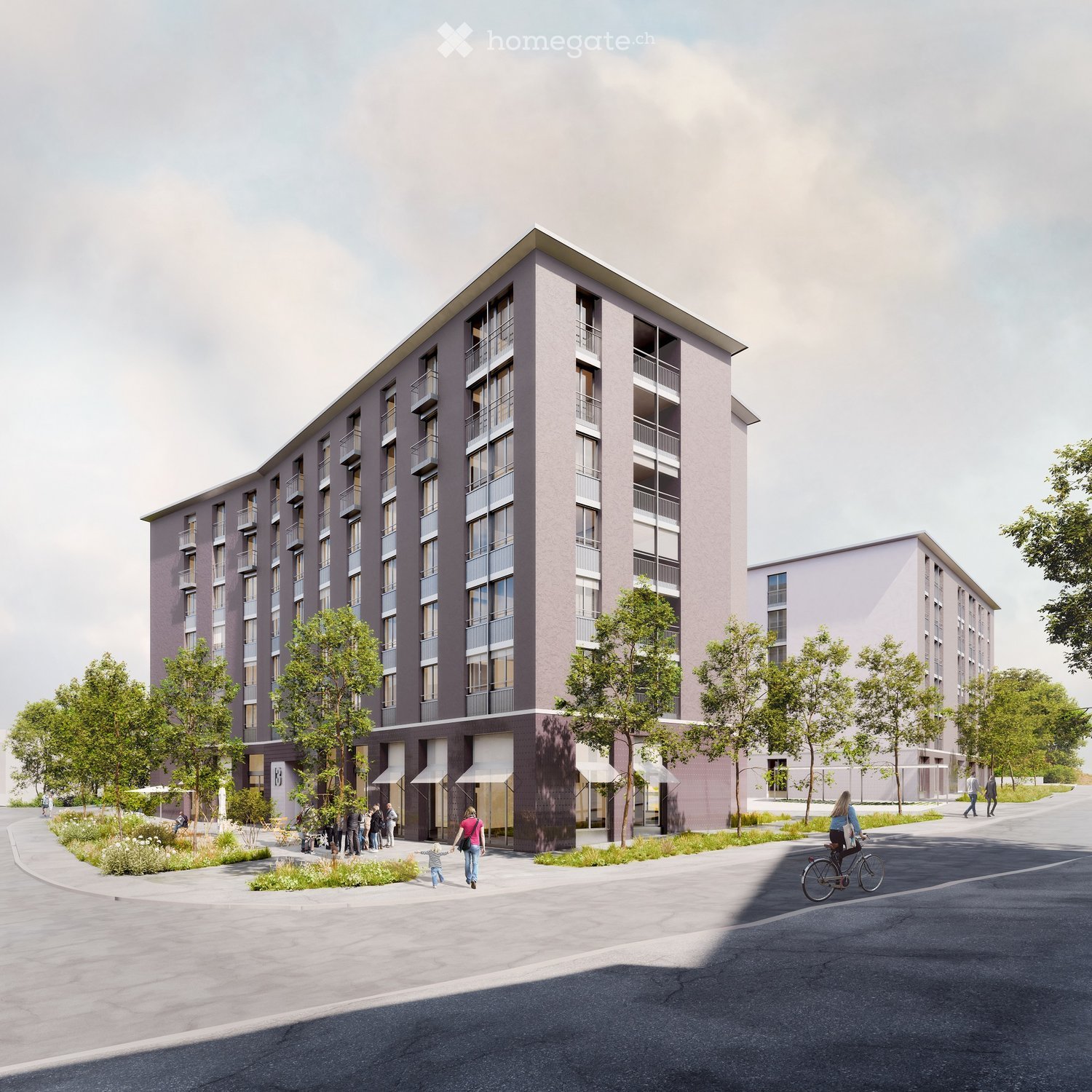 Modern multi-story residential building with balconies, surrounded by greenery and a paved walkway.