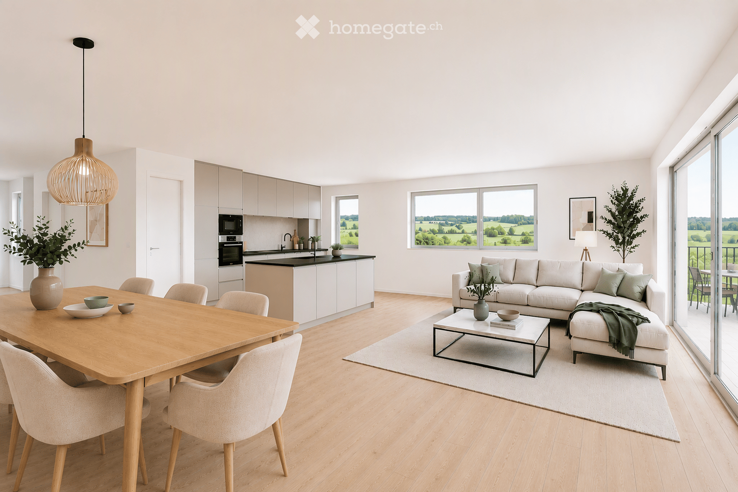 Open-plan living and dining area with a white sectional sofa, coffee table, dining table with chairs, modern kitchen with cabinets and appliances, pendant light, and large windows overlooking a green landscape.