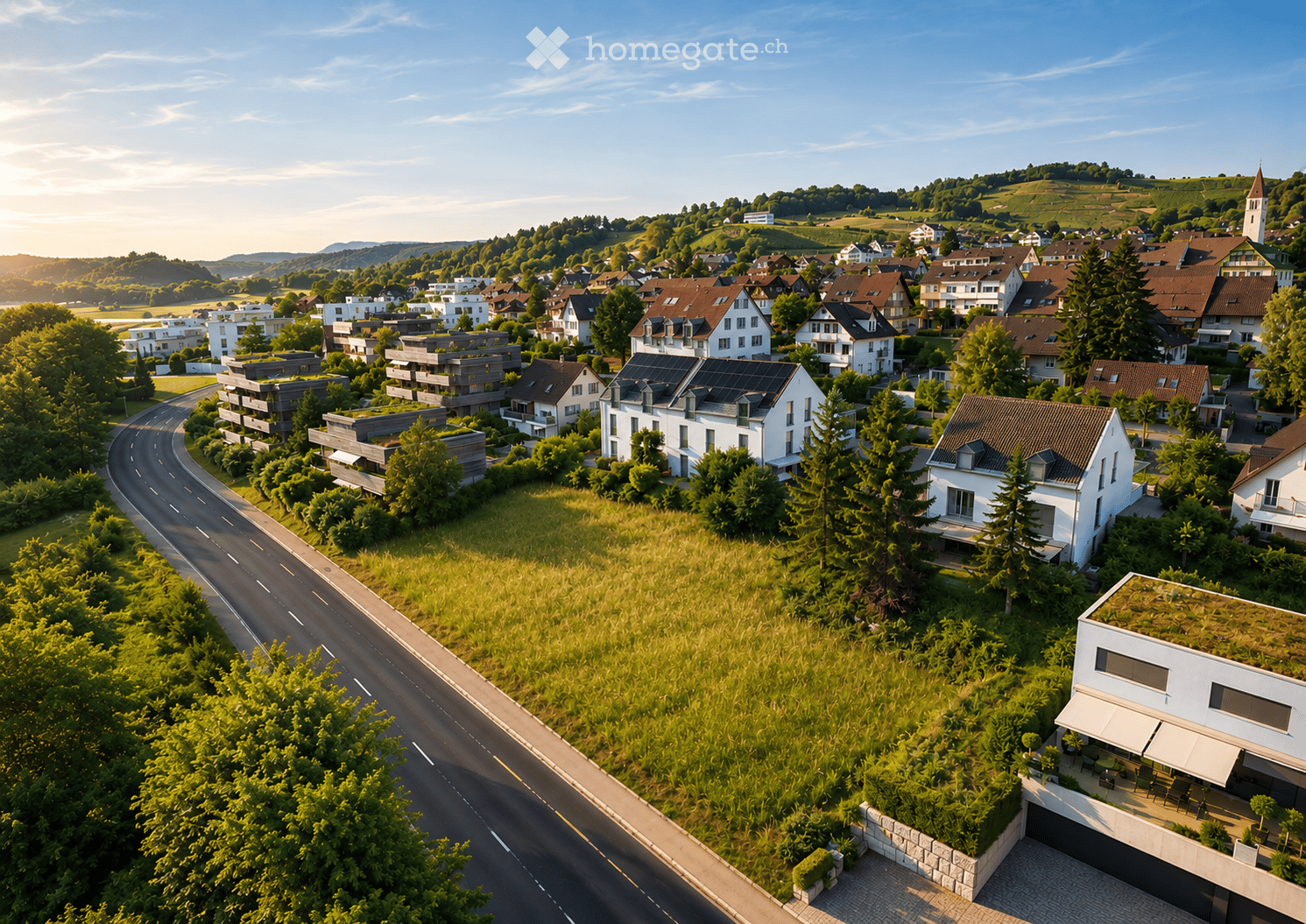 Aerial view of a suburban neighborhood with multiple residential houses, green spaces, and a winding road.
