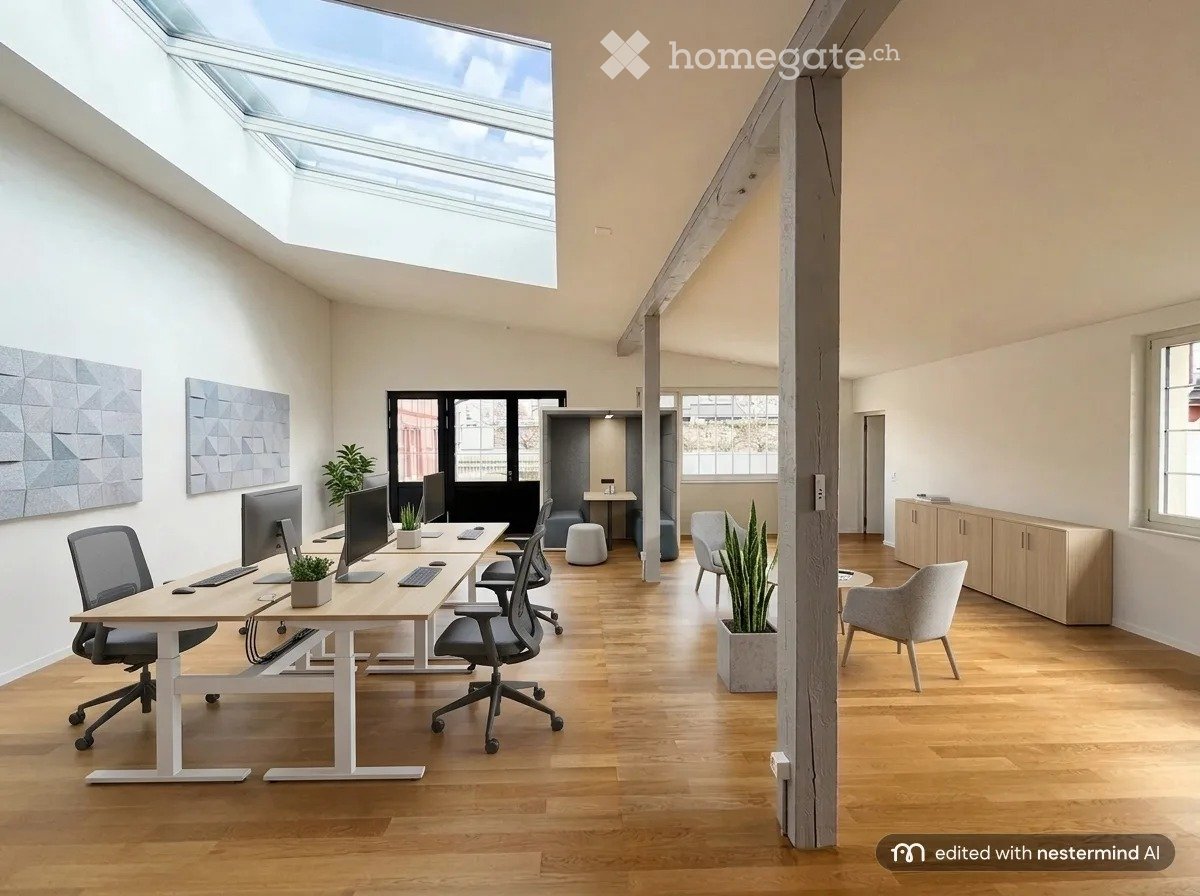 Modern office space with wooden flooring, large skylight, desks, chairs, screens, keyboards, mice, a small stool, cabinets, and potted plants.
