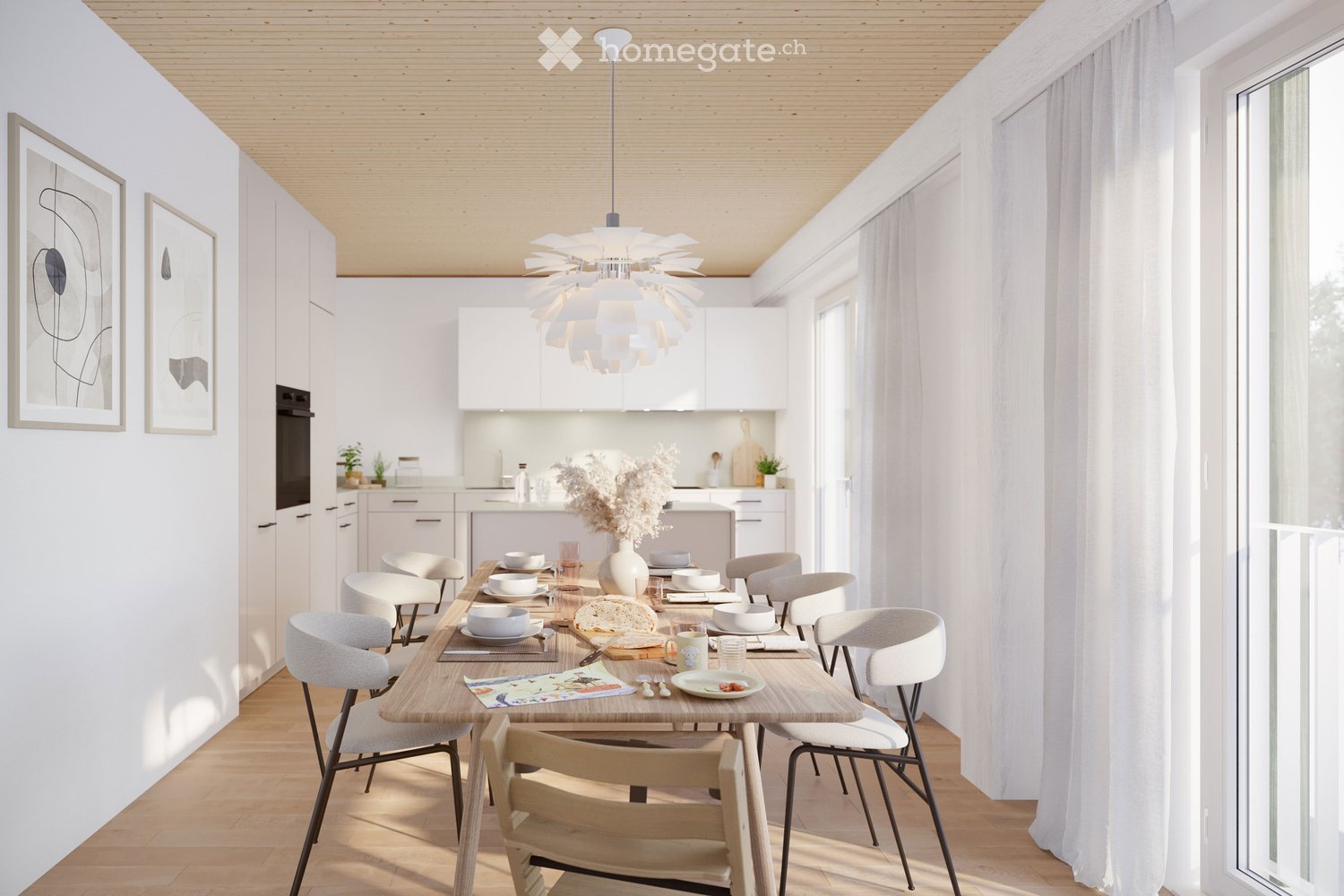 Modern open-plan dining and kitchen area with white cabinets, wooden dining table, six chairs, and various dishes and cups set for a meal. The space features a sleek pendant light fixture and large windows with white curtains.