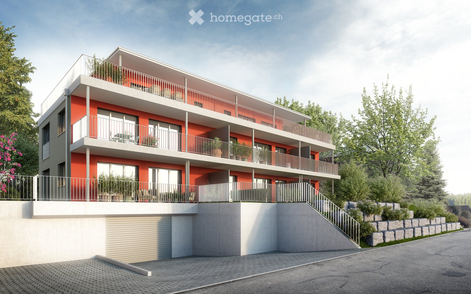 Modern three-story building with orange and white facade, multiple balconies, raised ground floor, and landscaped surroundings.
