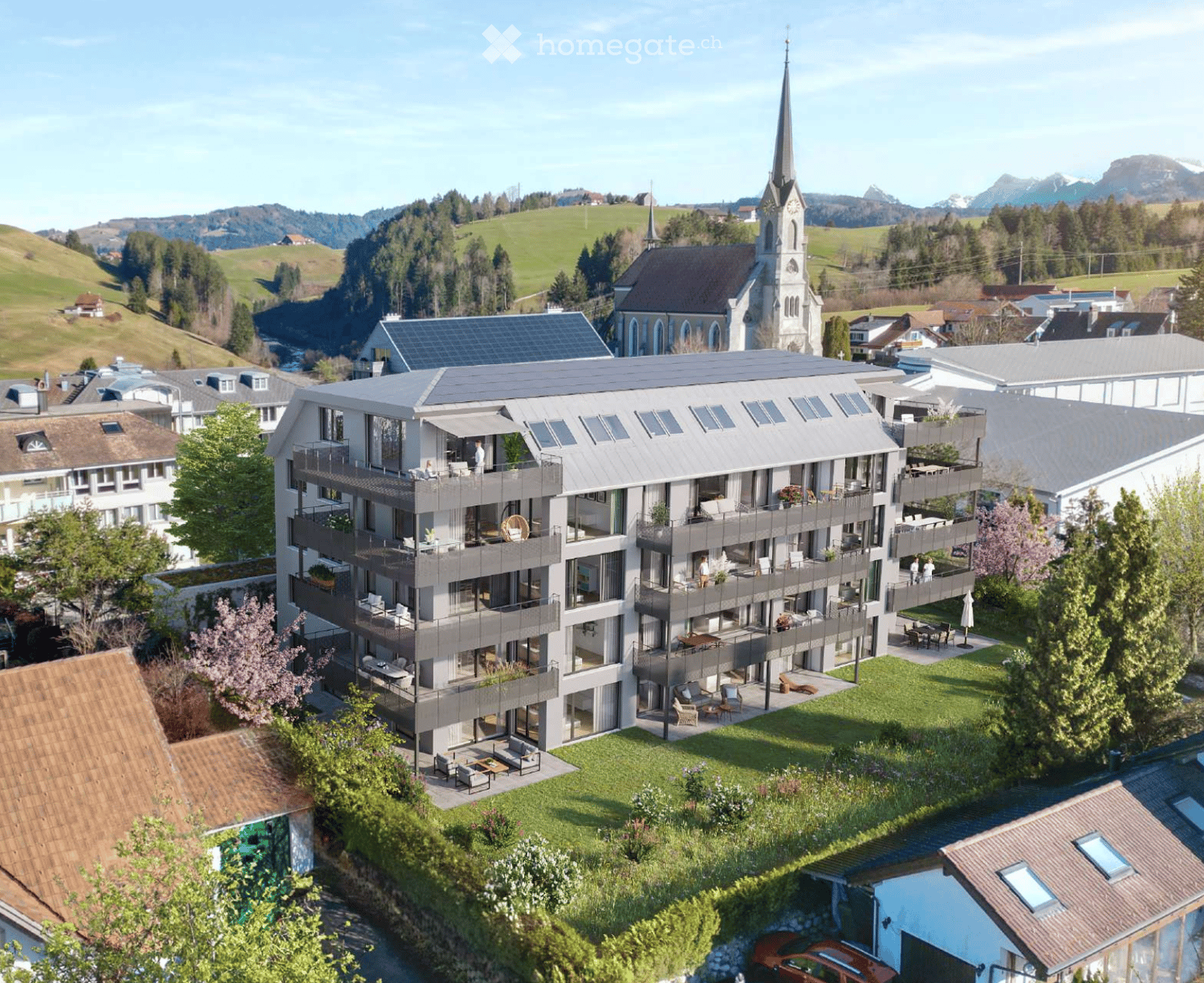 Modern multi-story residential building with balconies, surrounded by greenery and a church in the background.