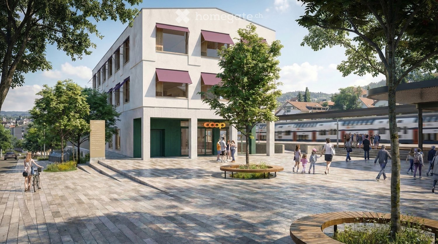 Modern building with a 'Coop' storefront, surrounded by trees and a paved area with benches and people walking.