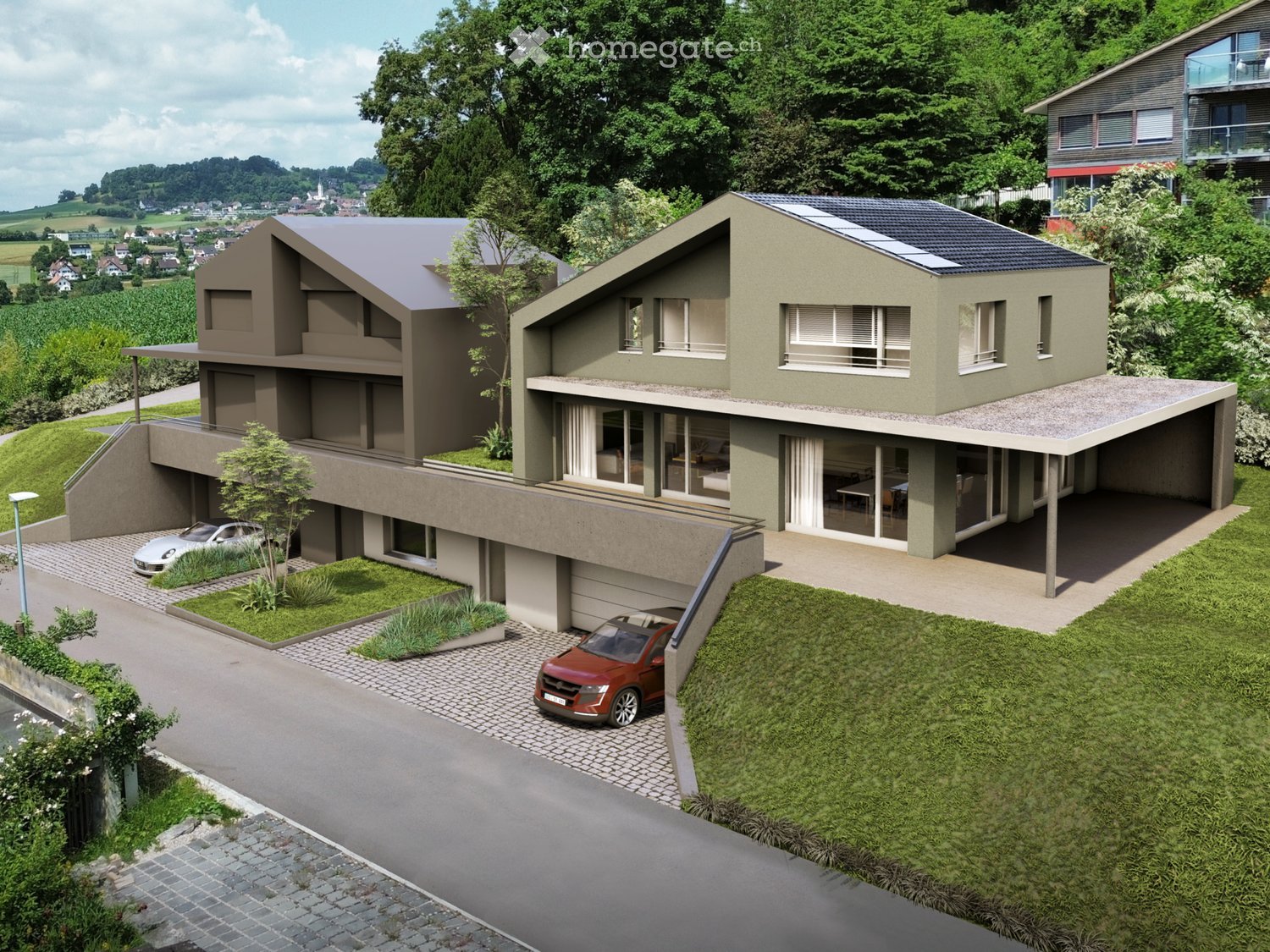 Modern two-story house with a flat roof, large windows, and a spacious terrace. Features a raised ground floor, garage, and parking area.