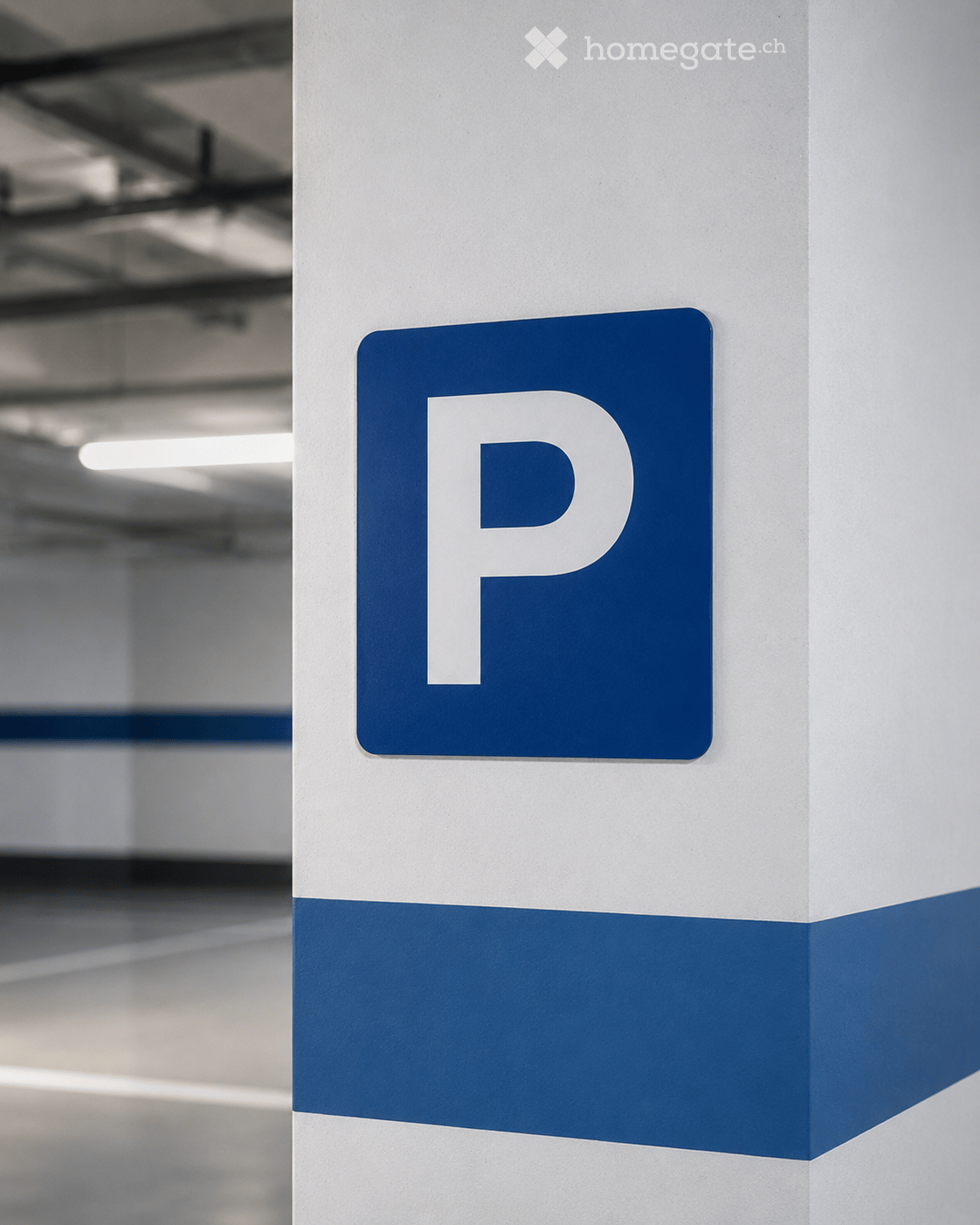 A parking sign with a large blue 'P' on a white pillar in an indoor parking area.