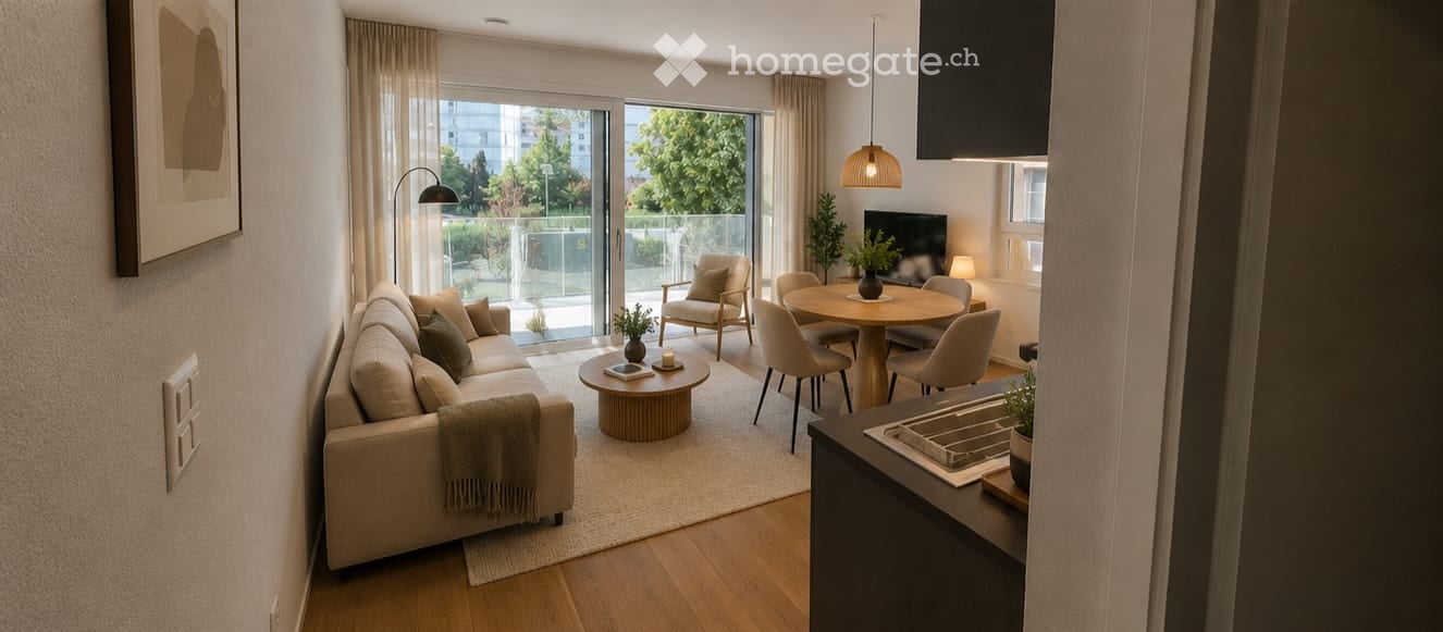Modern, open-plan living and dining area with a sofa, coffee table, dining table, chairs, armchair, TV, and pendant lights. Large sliding glass doors lead to a balcony with outdoor seating.