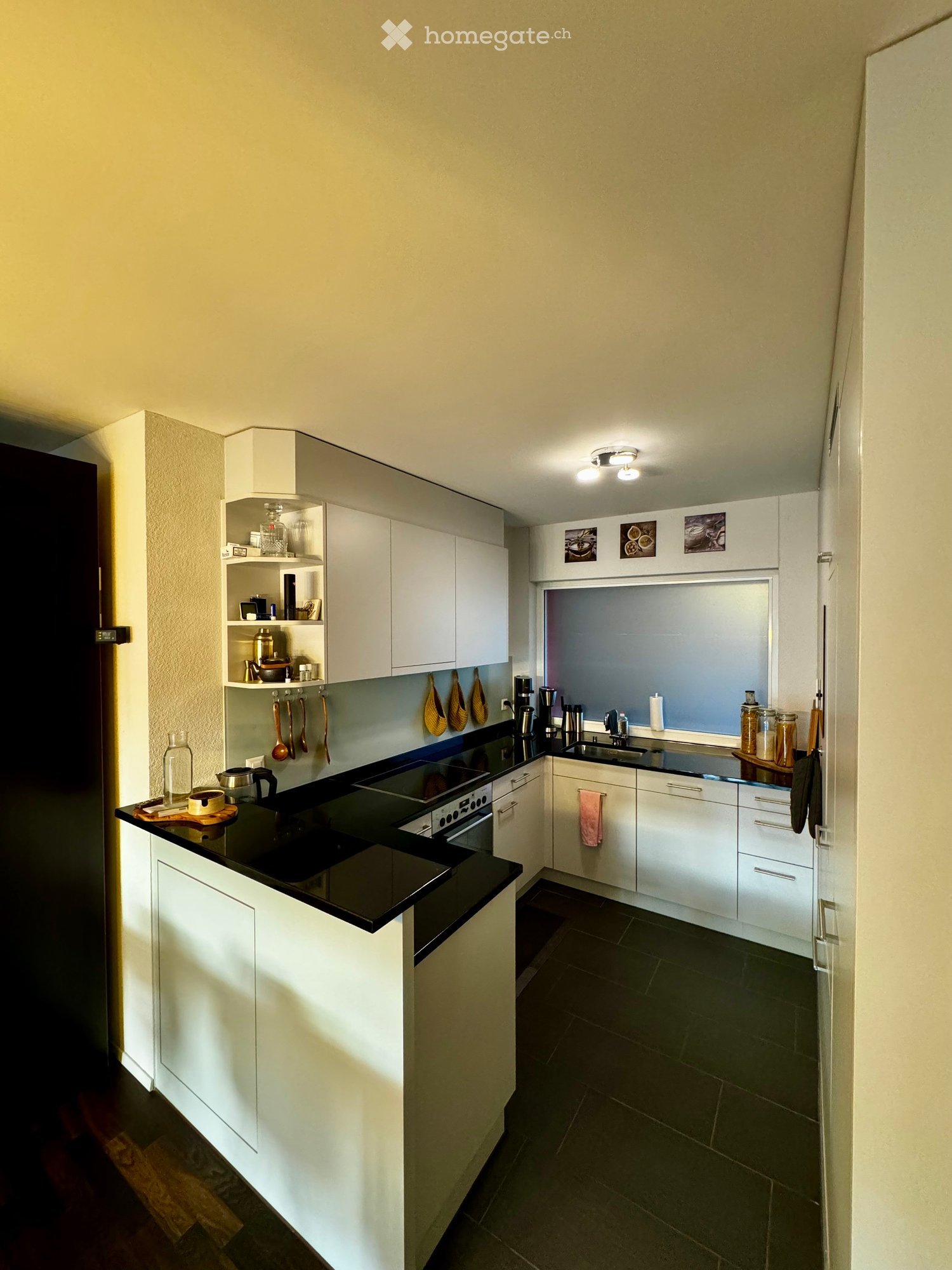 {"type": "Kitchen", "objects": ["cabinets", "sink", "faucet", "oven", "stove", "cupboard", "cup", "bottle", "frying pan", "oven mitts", "cupboard", "cupboard", "cupboard", "cupboard", "cupboard", "cupboard", "cupboard", "cupboard", "cupboard", "cupboard",