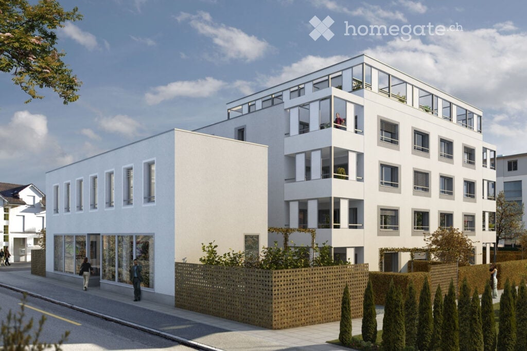 Modern multi-story residential building with white facade, large windows, and balconies. The building features contemporary design with clean lines and a mix of glass and concrete elements.