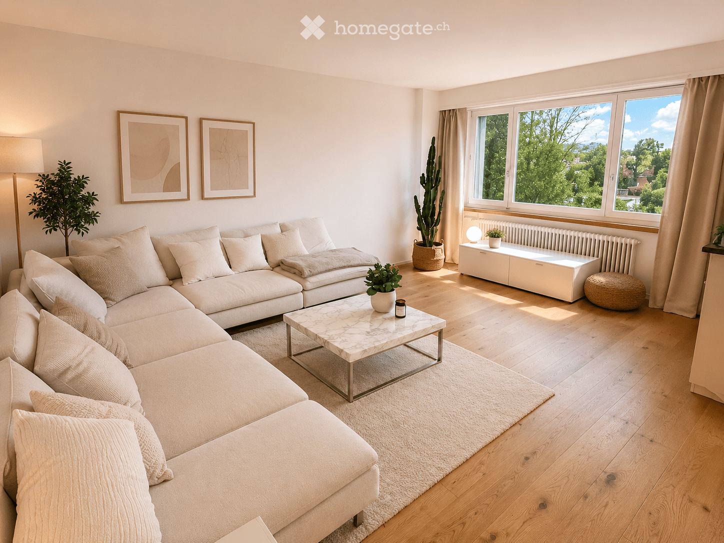 Modern living room with light wooden flooring, large sectional sofa, coffee table, floor lamp, and potted plants.