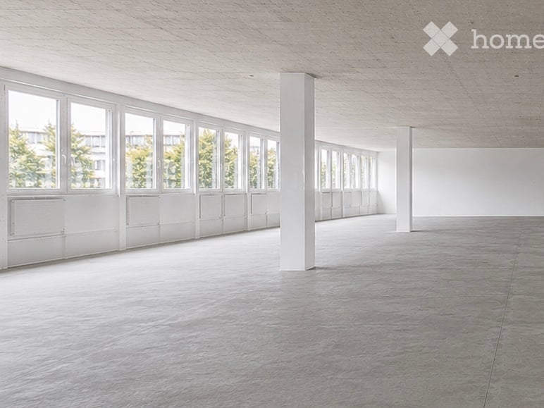 Completely empty room with bare walls and polished concrete floor. No furniture or equipment.