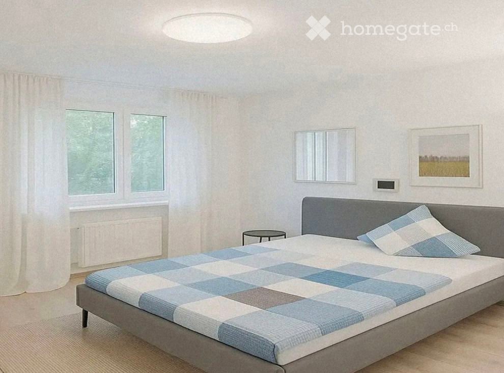 Modern bedroom with a grey bed, blue and white checkered bedding, a nightstand, a mirror, and a picture frame on the wall.