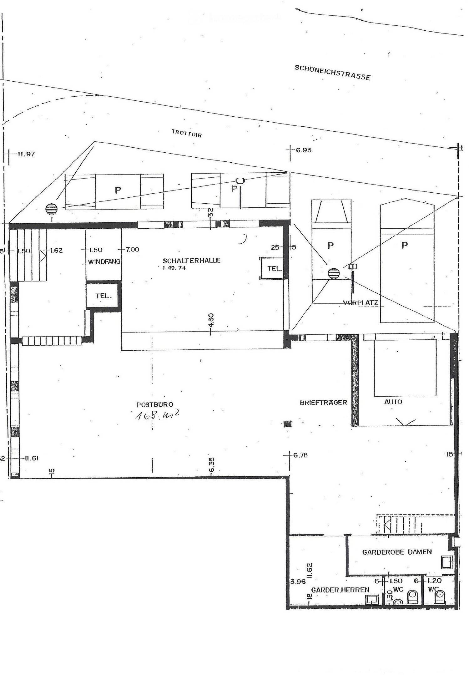 Floor plan of a building showing various rooms and areas including a switch hall, post office, mail carrier area, auto area, and separate men's and women's cloakrooms with WC facilities.