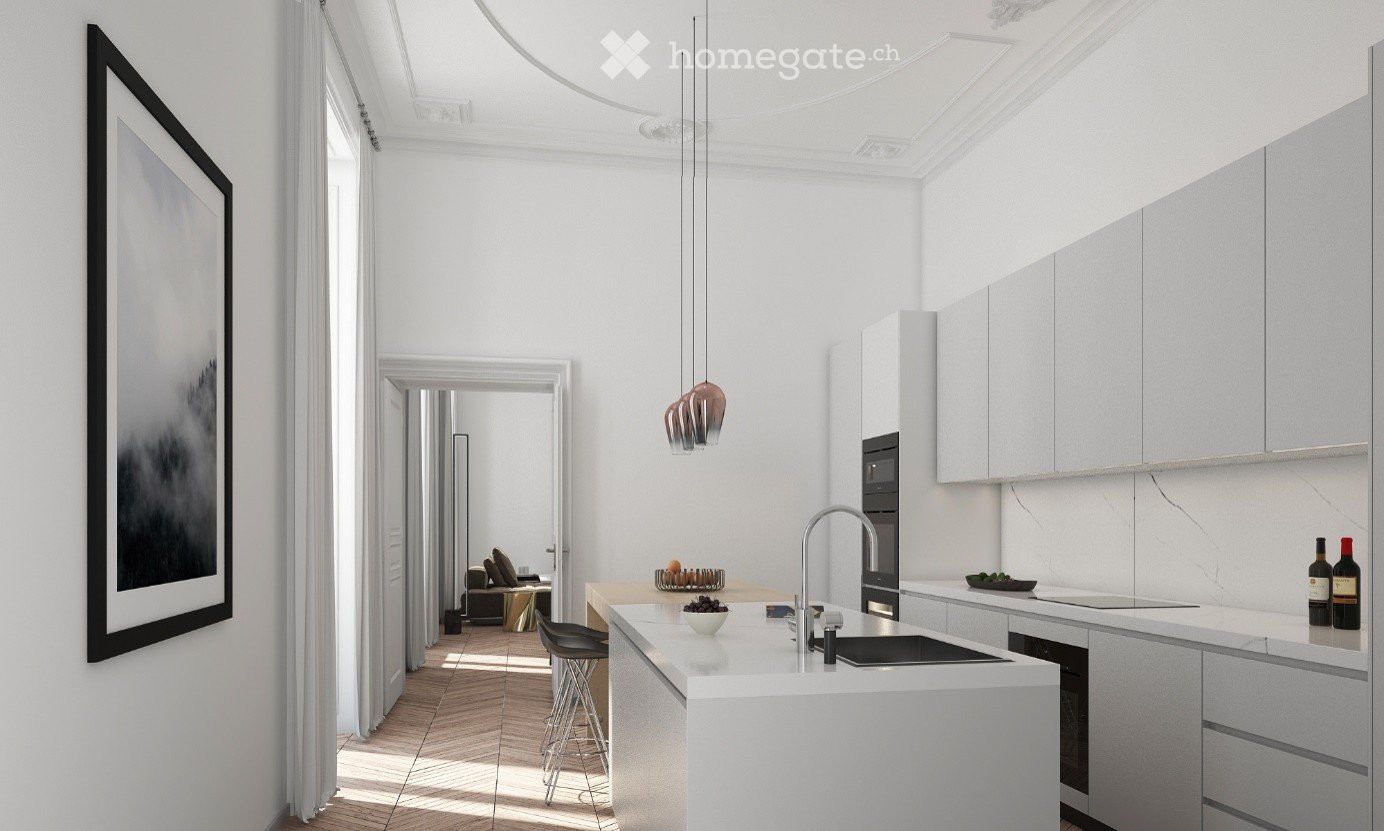 Modern kitchen with white cabinets, a central island, and a sleek sink. A framed picture hangs on the wall, and a living area is visible through an open doorway.